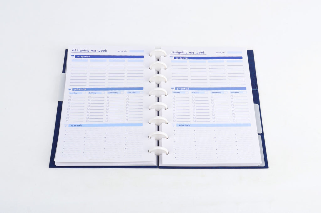 StratoPlanner weekly spread showing categorize, prioritize, and schedule sections